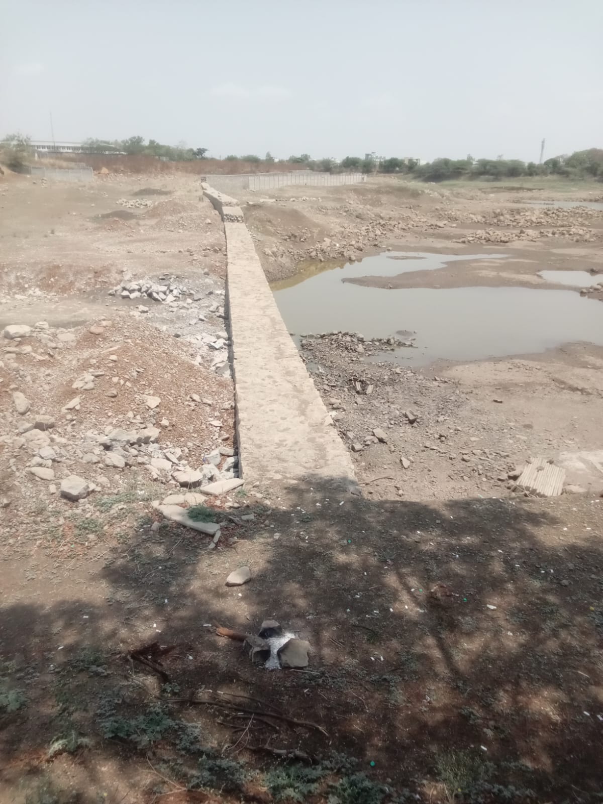 Stone check dam across a riverbed for water conservation