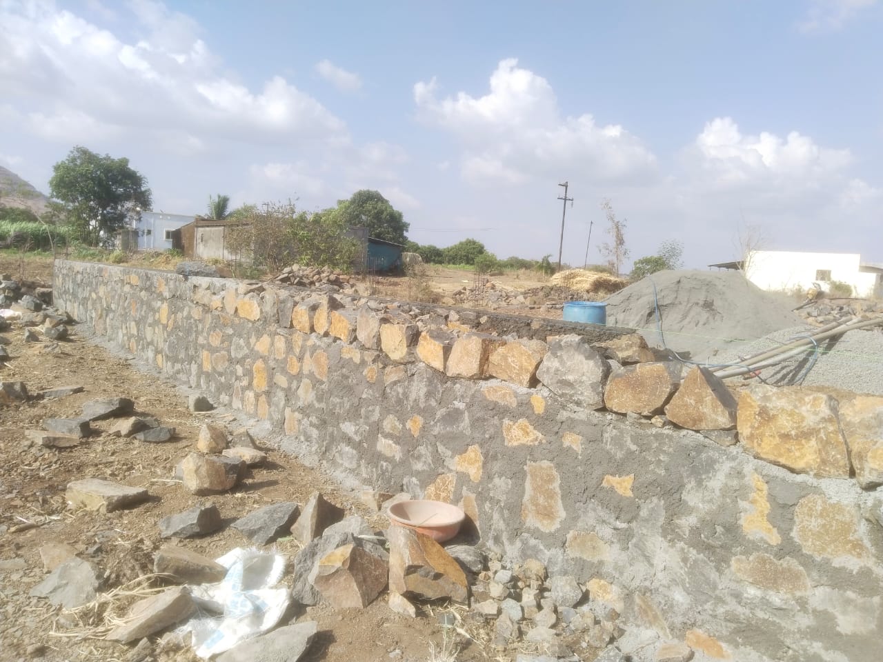 Natural stone compound wall on a rural plot