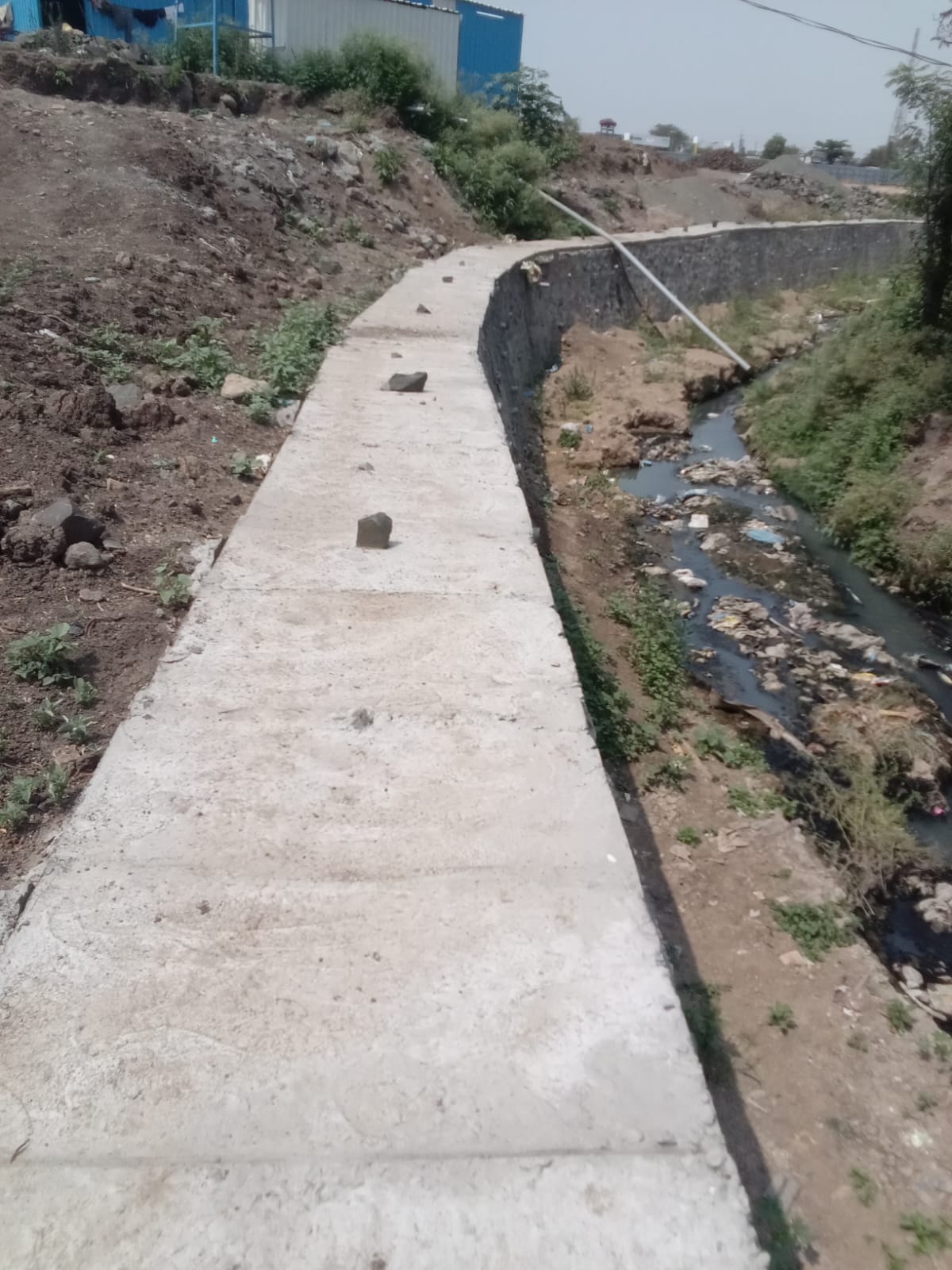 Completed nala lining project with retaining wall