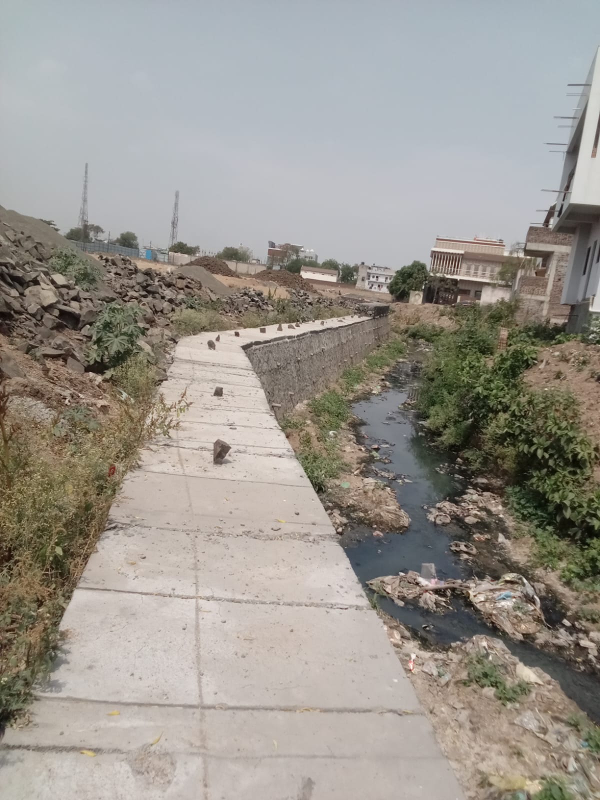 Drain rehabilitation with stone retaining wall